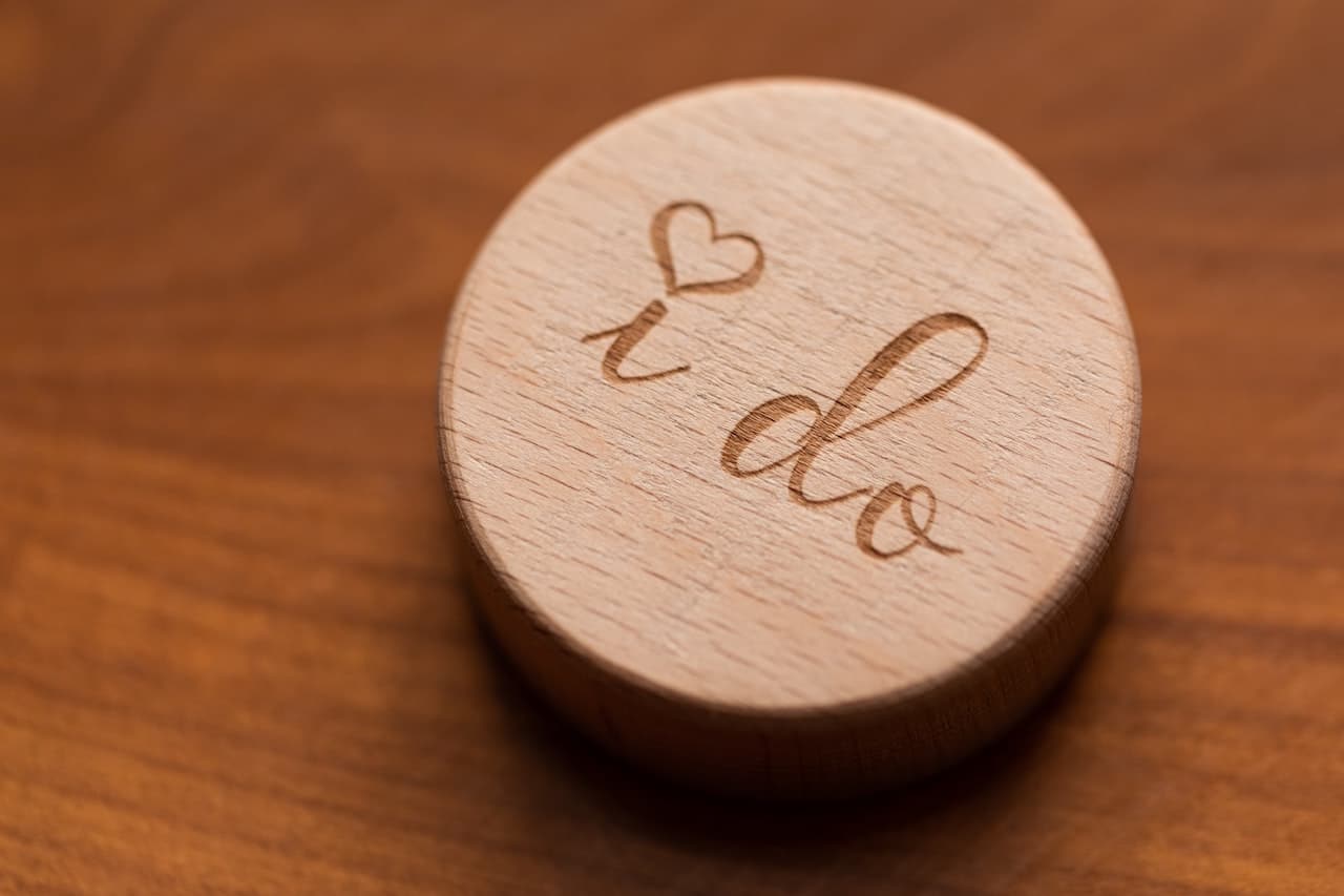 A ring holder that says "I do" for a vow renewal ceremony