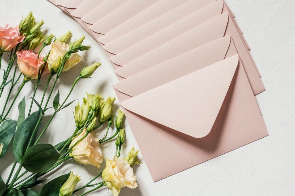 wedding invitations in pink envelopes