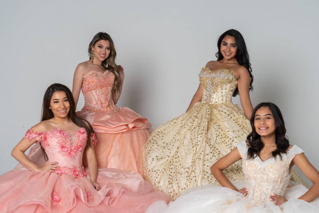 four teen girls in quinceanera dresses