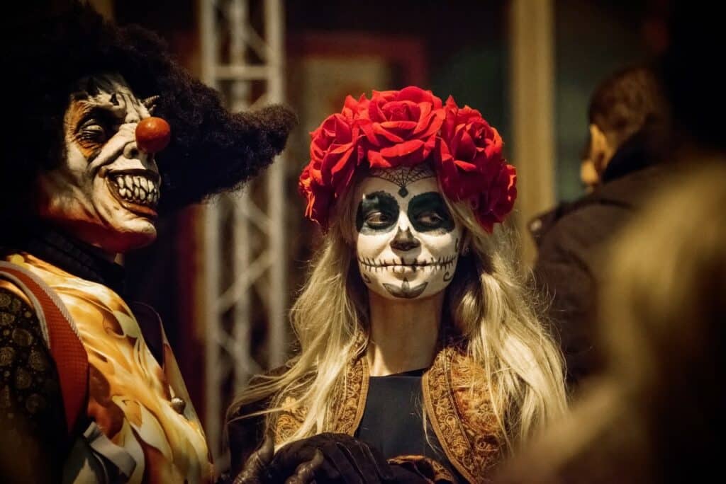 woman dressed in day of the dead costume for halloween party