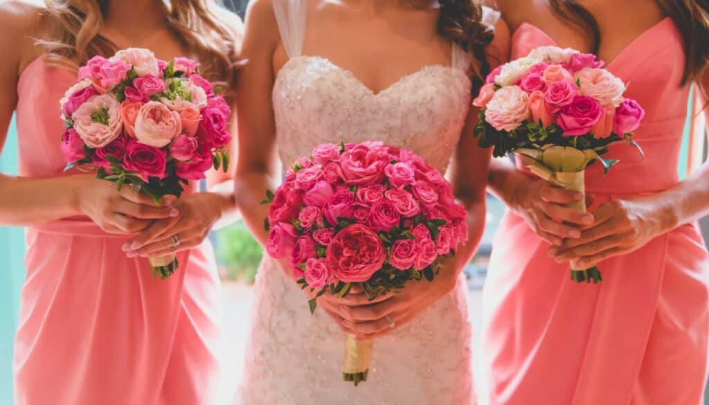 bride and bridesmaids holding wedding bouquets
