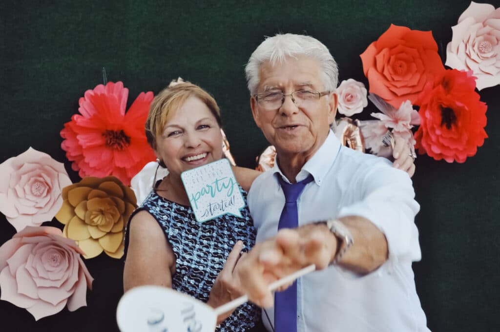 guests in photo booth at wedding