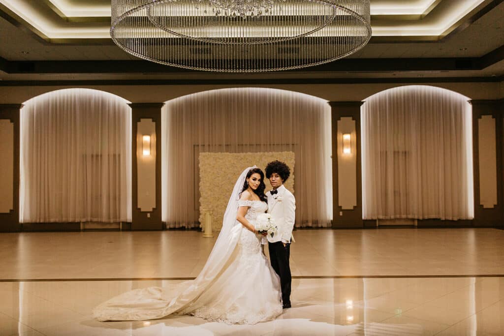 Bride and groom posing for picture.