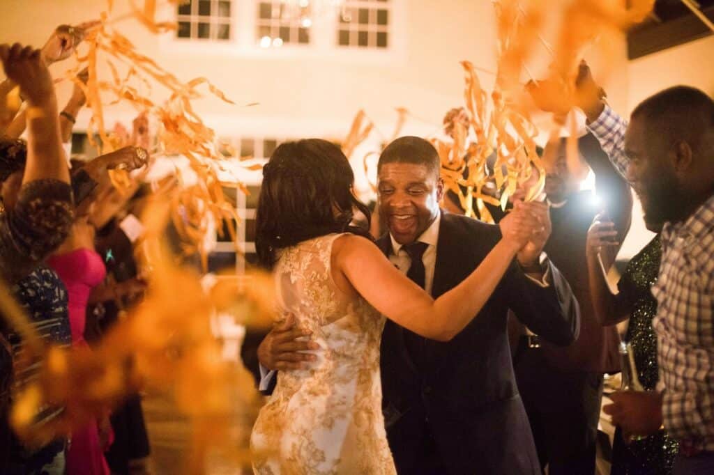 Bride and groom dancing into wedding event.