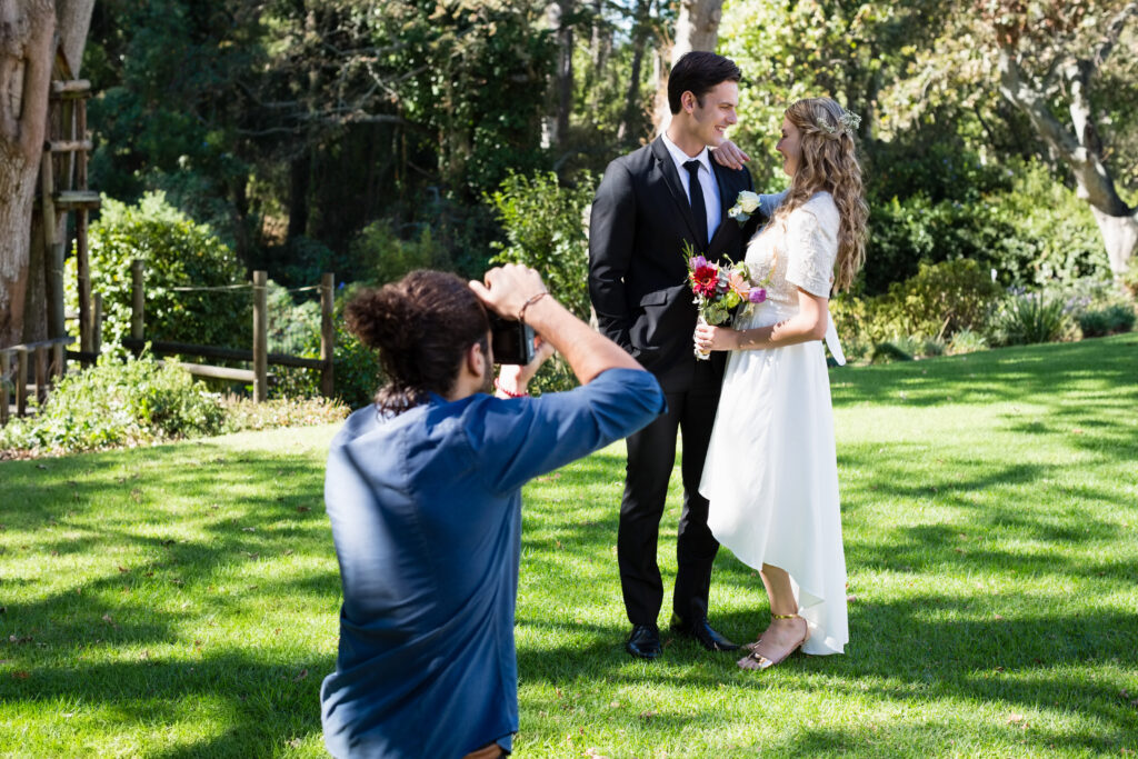 photographer takes photo of bride and groom