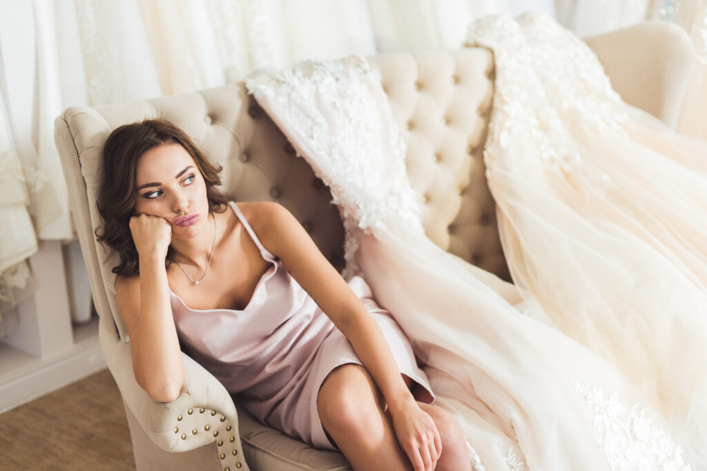 Bored bride sitting on sofa