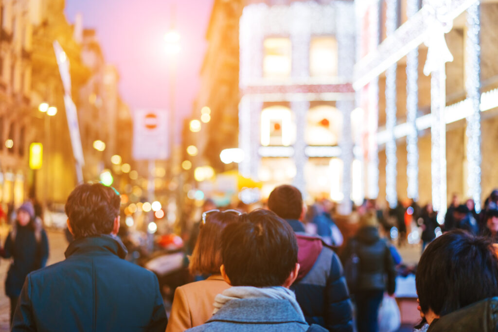 Crowd of people walking in city