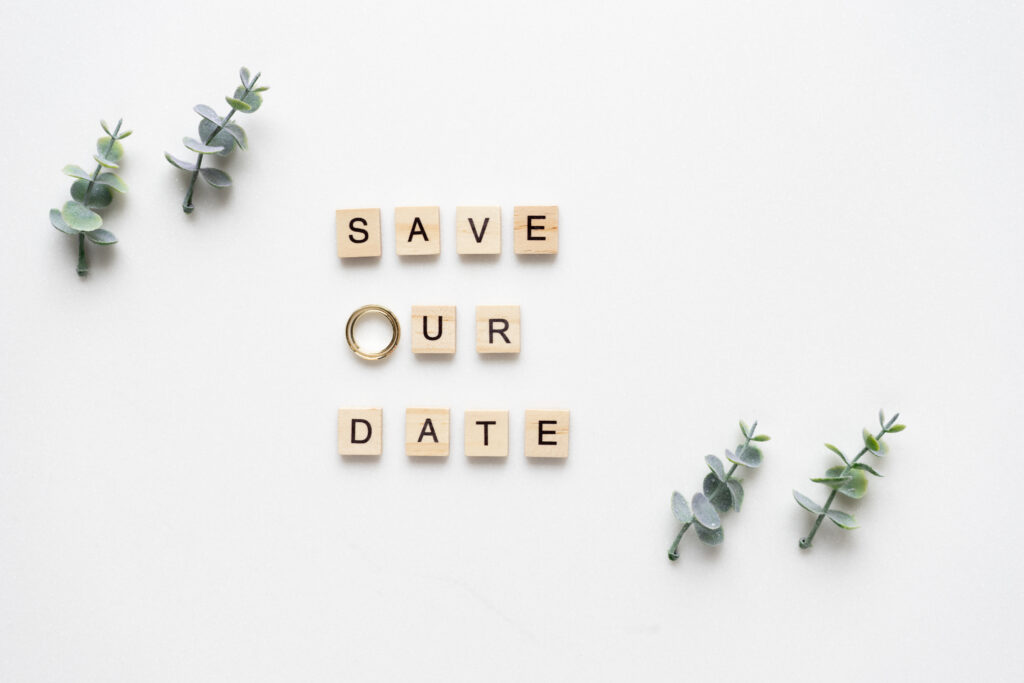 Wooden letters spelling save our date