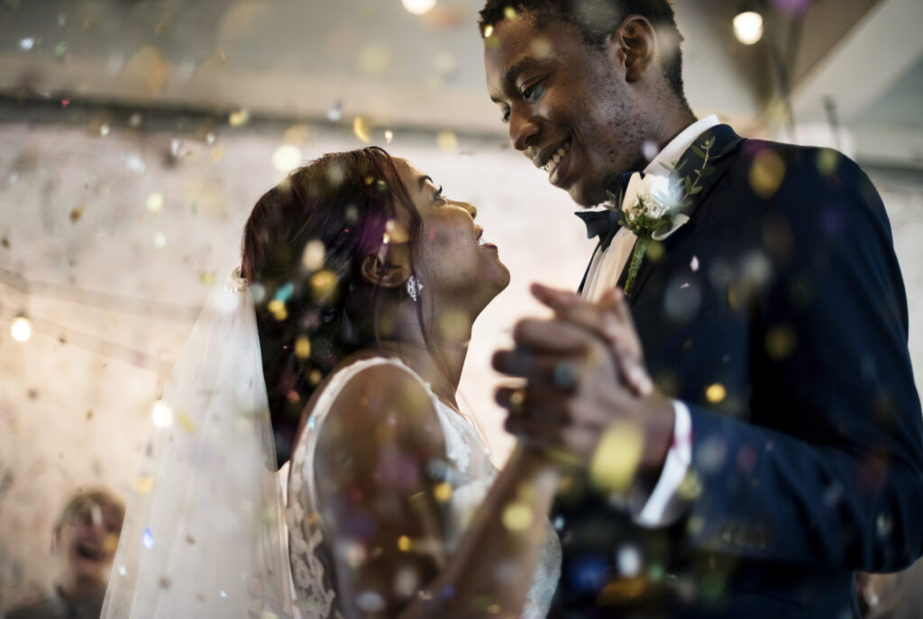 Black bride and groom dancing