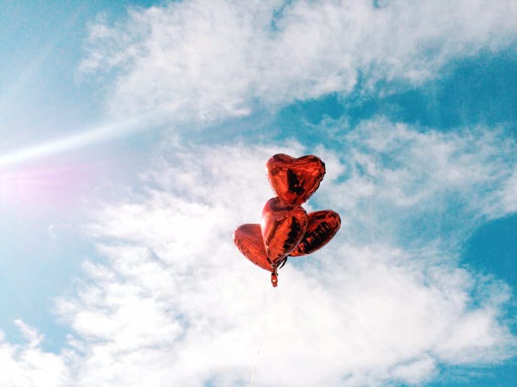 valentine's heart balloons floating in the sky