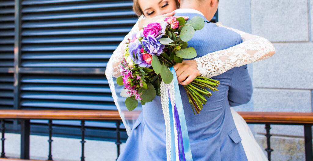 bride and groom embracing