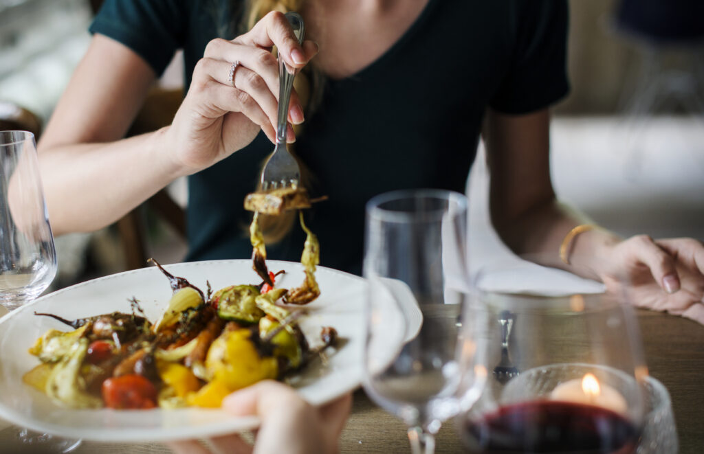 closeup of wedding guest eating meal