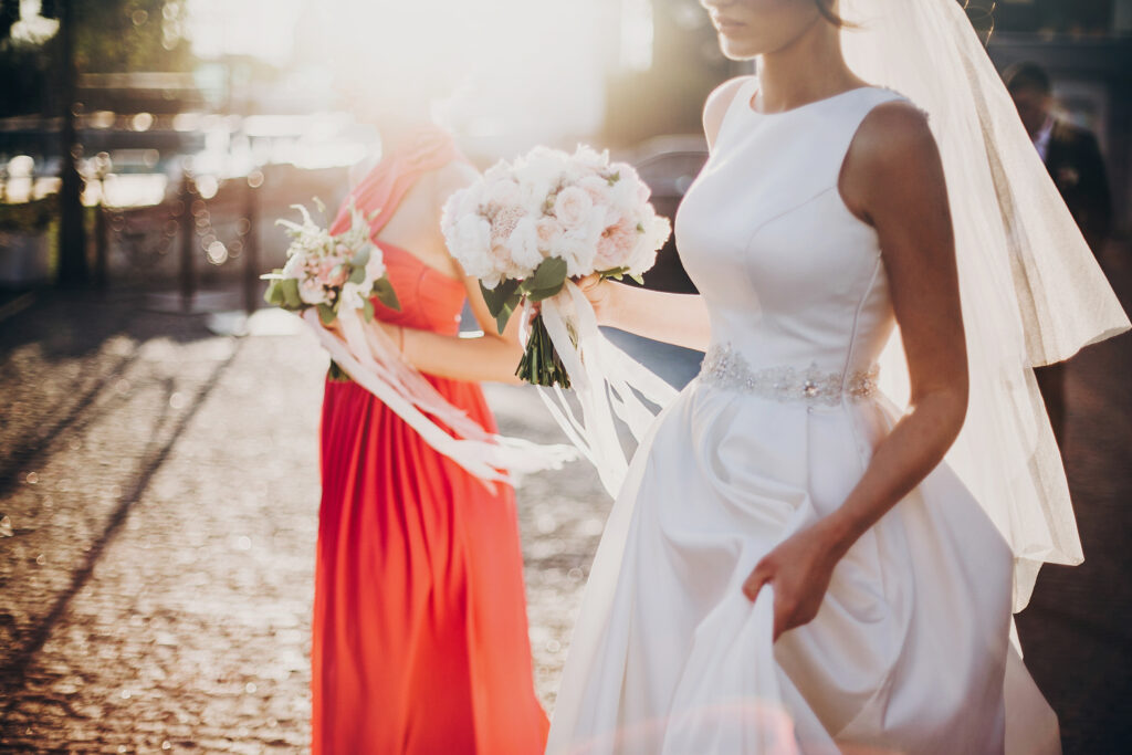 bride walking with bridesmaid