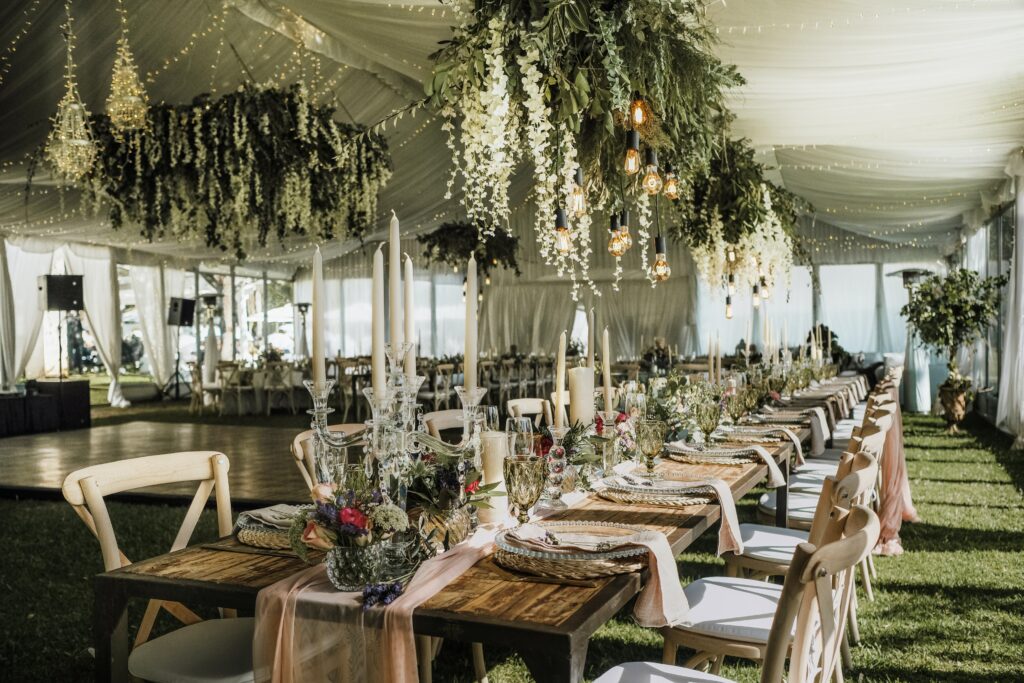 outside rustic wedding reception under a white tent