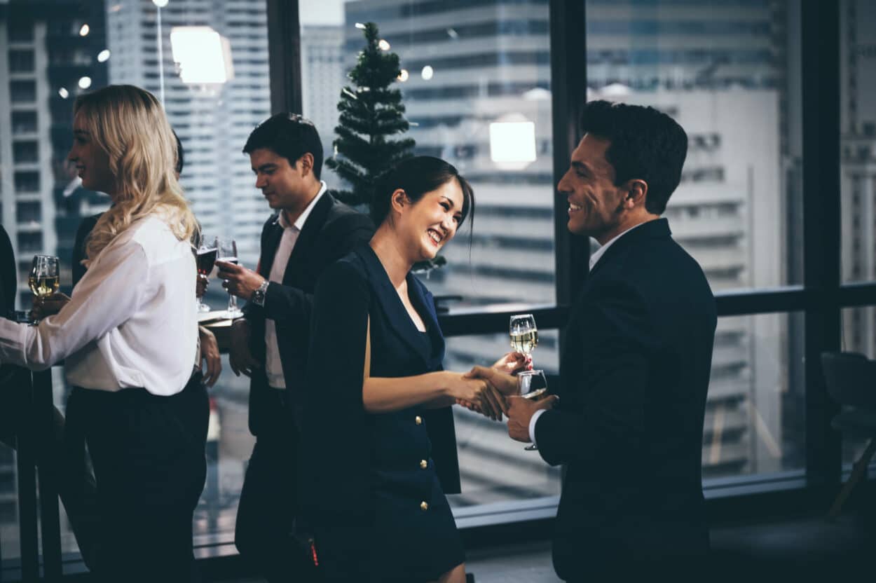 employees chatting at corporate holiday party
