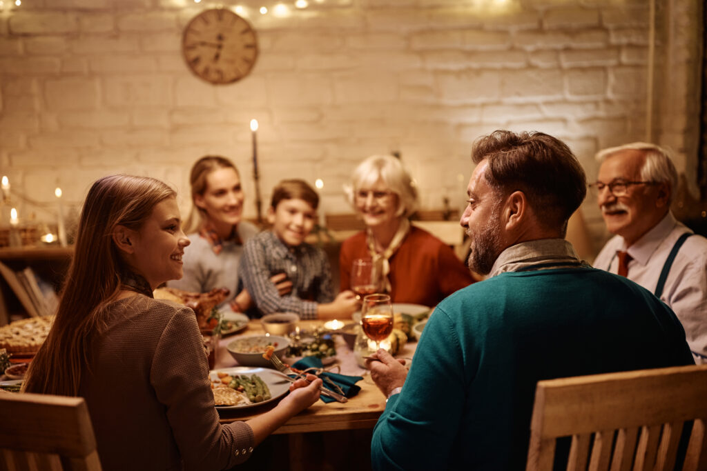 family eats dinner around cozy table