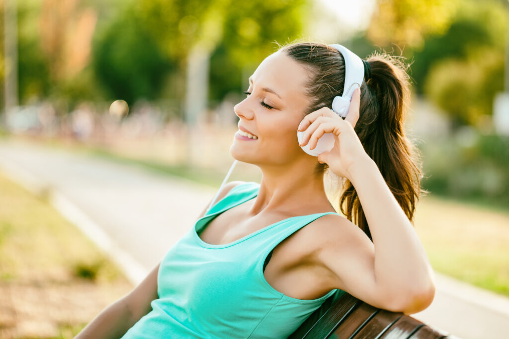 female runner listening to music