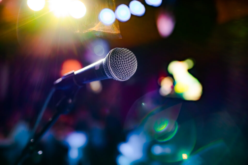 Microphone on stage against a background of auditorium
