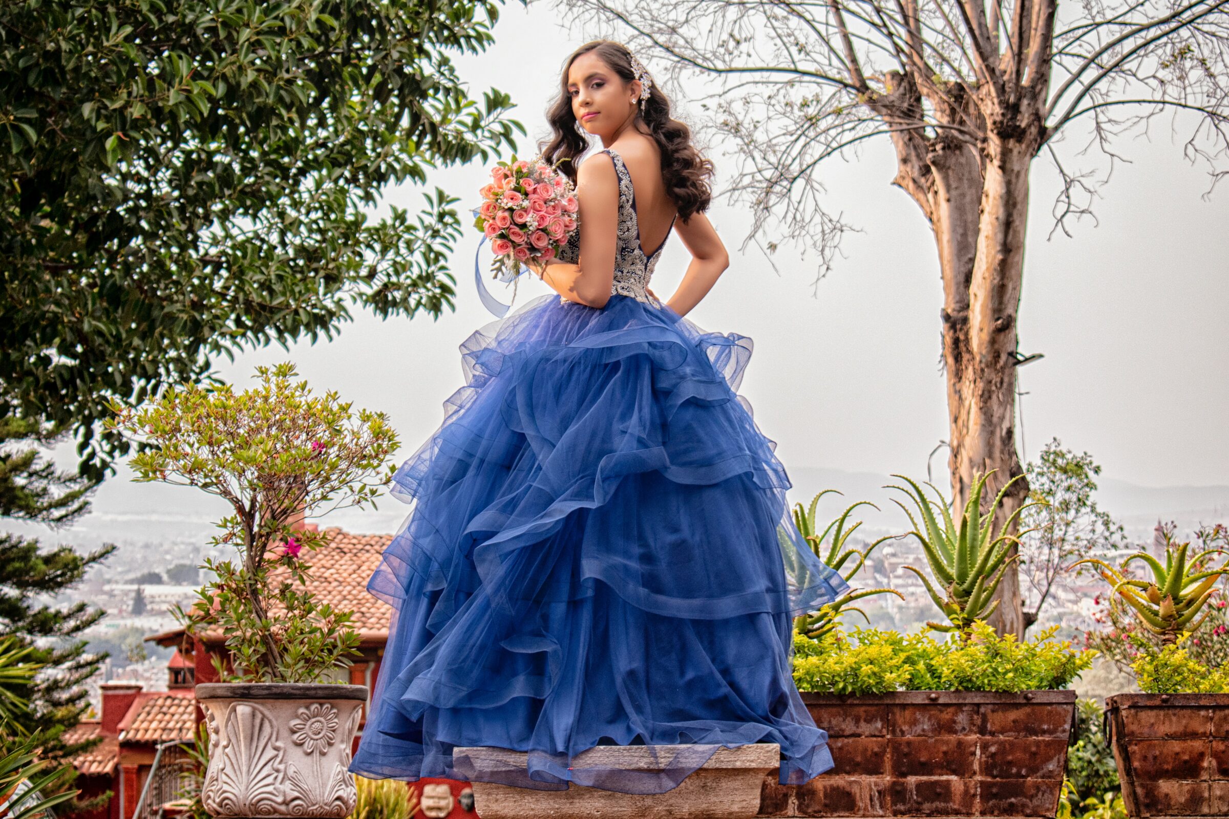 girl in a dark blue quinceañera dress
