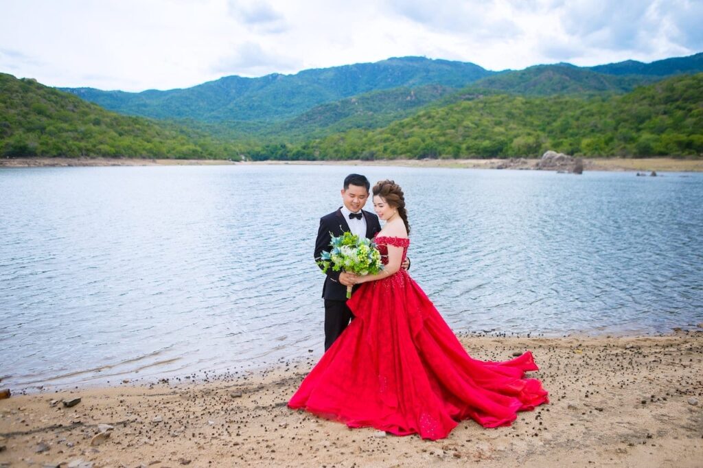 bride in red wedding dress with groom