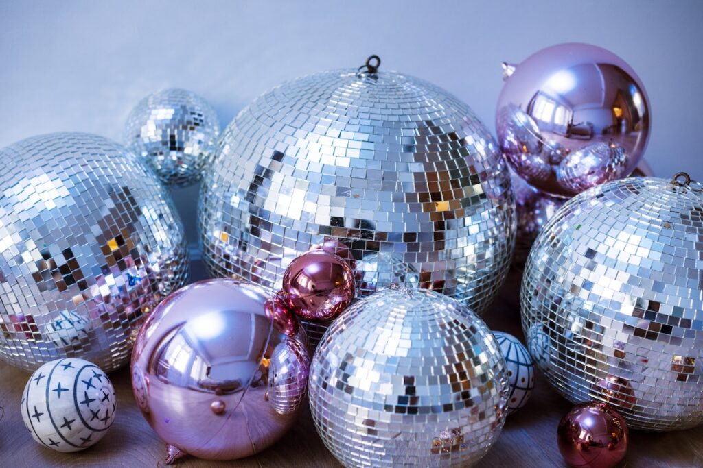 silver and pink disco balls in a party
