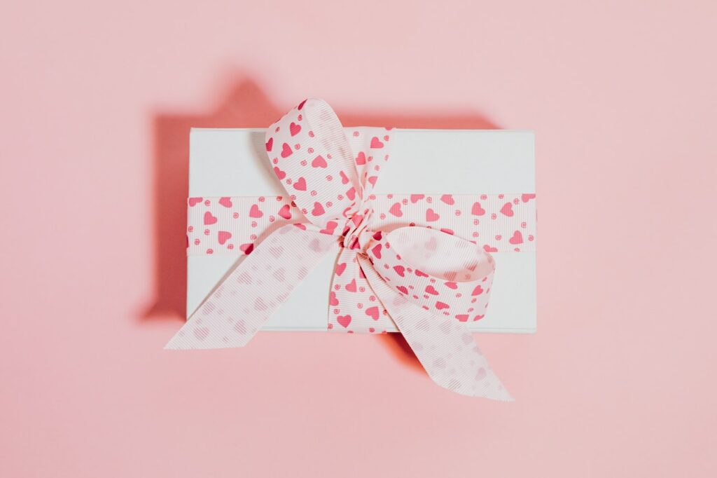 invitation with hearts and pink ribbon
