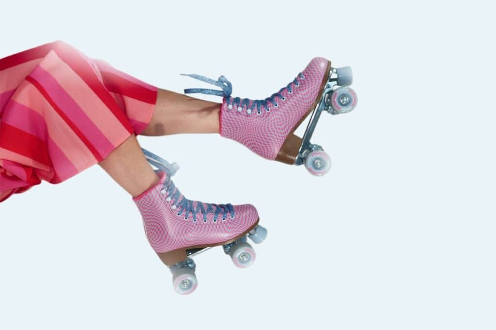 woman in pink roller skates
