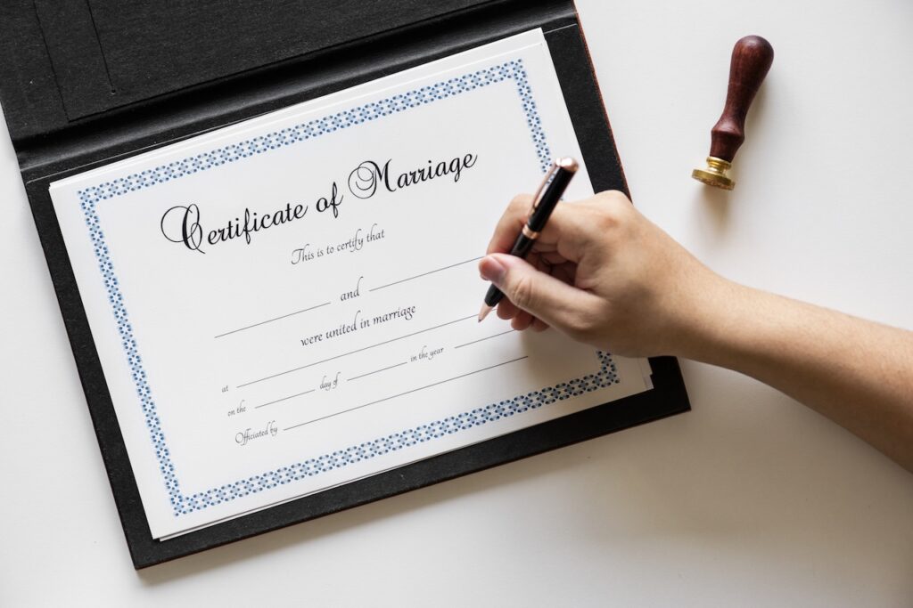 hand signing on marriage certification