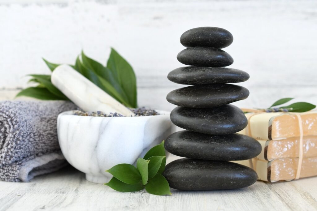 spa day stacked massage stones lavender mortar
