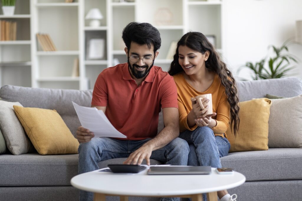 engaged couple planning budget together