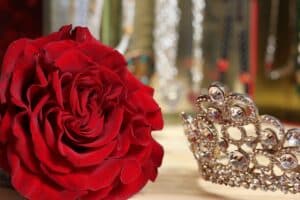 rose and tiara on top of a table