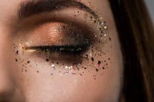 closeup of glittery eye makeup on young woman