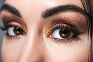 close up of young woman with smokey eye makeup