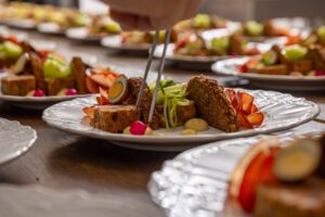 close up of fancy dinner on plates for party