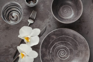 elegant table setting with grey ceramic plate