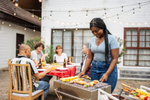 family having fun outside and grilling