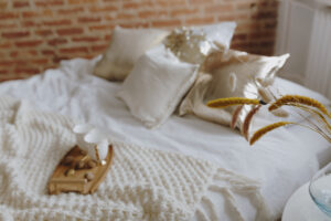 wooden tray with coffee on bed