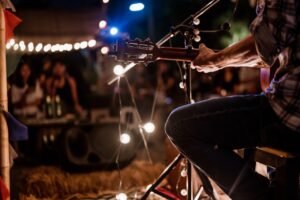 musician playing at a venue