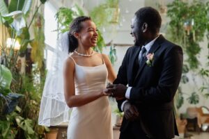 young couple at wedding reception laughing