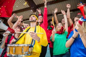 high school students in stands cheering