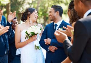 happy bride and groom walking through line on wedding day