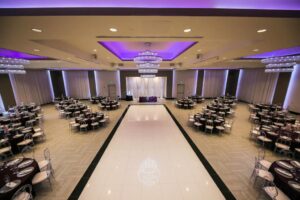 marinaj banquet hall with purple accent colors and tables set up