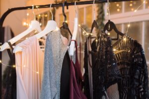 clothes rack with different dresses on it