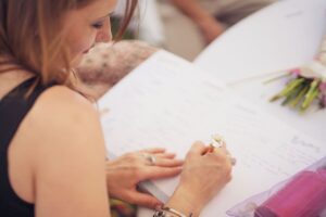 bride to be working on her wedding guest list