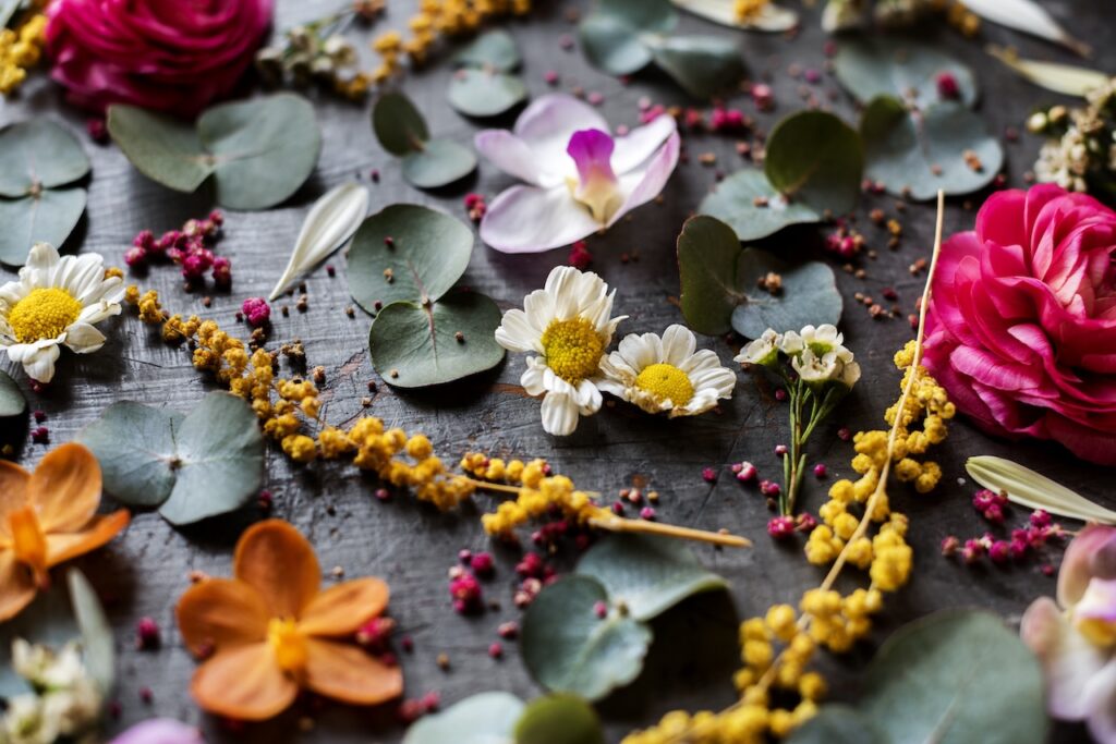 flowers and greenery on dark table