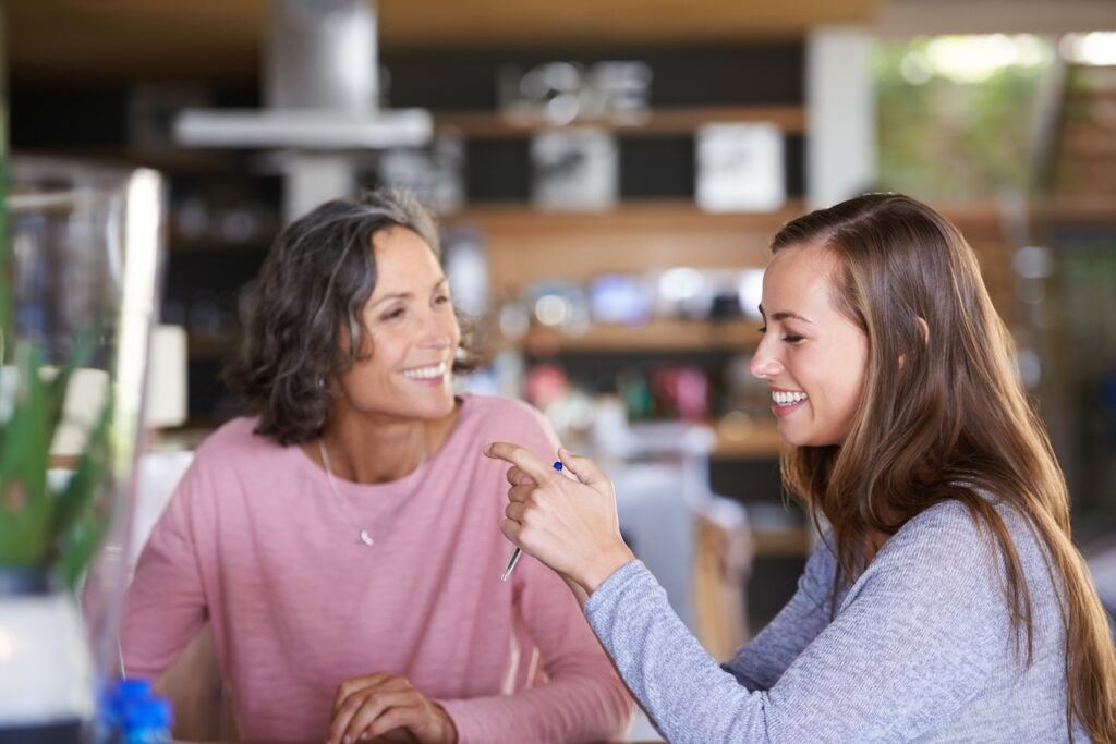 mother and daughter having a discussion together