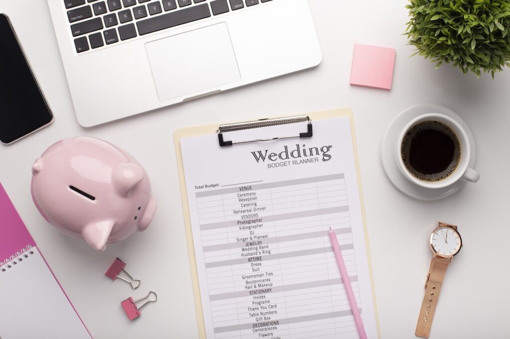 Wedding budget planning on workplace with laptop